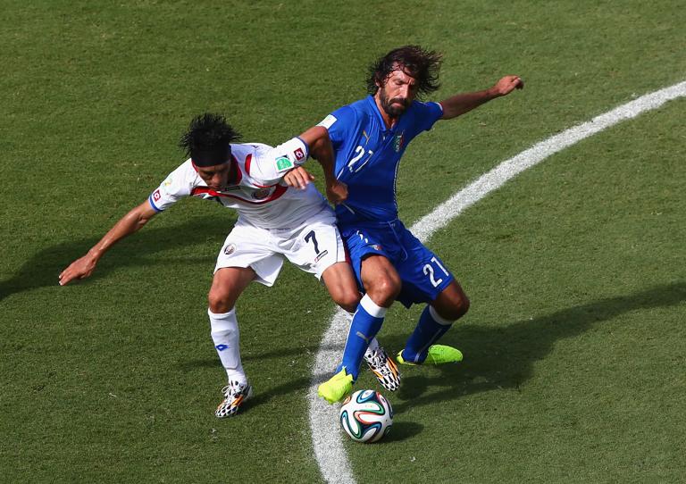 RECIFE, BRAZIL - JUNE 20:  Christian Bolanos of Costa Rica and Andrea Pirlo of Italy compete for the ball during the 2014 FIFA World Cup Brazil Group D match between Italy and Costa Rica at Arena Pernambuco on June 20, 2014 in Recife, Brazil.  (Photo by Michael Steele/Getty Images)