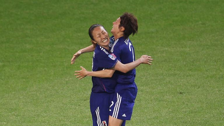 WOLFSBURG, GERMANY - JULY 09:  Karina Maruyama (L) of Japan celebrates her first goal with her teammate Yukari Kinga during the FIFA Women's World Cup quarter finals match between Germany and Japan on July 9, 2011 in Wolfsburg, Germany.  (Photo by Alexandra Beier - FIFA/FIFA via Getty Images)