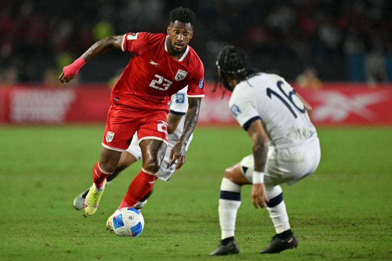 Panama's defender #23 Michael Murillo runs with the ball past Guatemala's defender #16 Jose Morales during the 2026 FIFA World Cup Concacaf qualifier football match between Panama and Guatemala at the Rommel Fernandez Gutierrez Stadium in Panama city on September 8, 2025. (Photo by Martin BERNETTI / AFP via Getty Images)