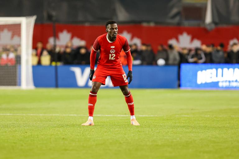 Tani Oluwaseyi of Canada watches the team play during the International Friendly match between Canada and Ecuador at BMO Field in Toronto, Ontario, Canada, on November 13, 2025. (Photo by Indrawan Kumala/NurPhoto via Getty Images)