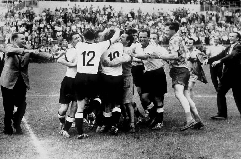 BERN, SWITZERLAND - JULY 4: The German Team celebrate after they won the FIFA World Cup 1954 final match between Hungary and Germany on July 4, 1954 in Bern, Switzerland. (Photo by Bongarts/Getty Images)